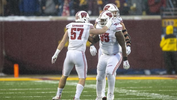 Jack Sanborn celebrating with Keeanu Benton. (Credit: Jesse Johnson-USA TODAY Sports)